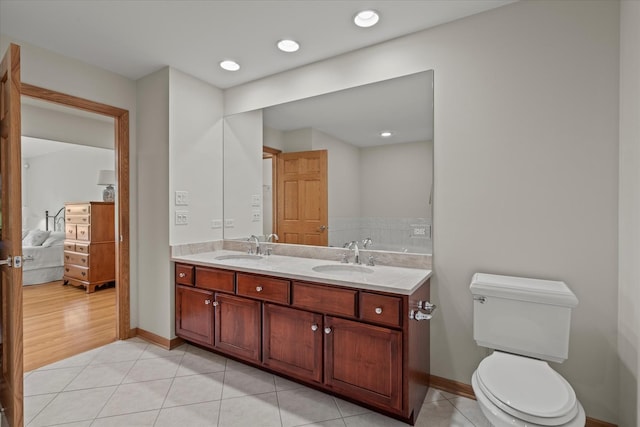 12195 Oxford Ct, Lemont, IL 60439 - full bathroom featuring tile patterned floors, toilet, double vanity, and baseboards