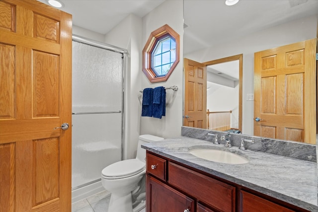 12195 Oxford Ct, Lemont, IL 60439 - bathroom featuring a shower stall, toilet, vanity, and tile patterned flooring