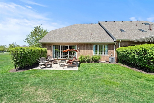 12195 Oxford Ct, Lemont, IL 60439 - rear view of property featuring brick siding, a patio area, a lawn, and a shingled roof