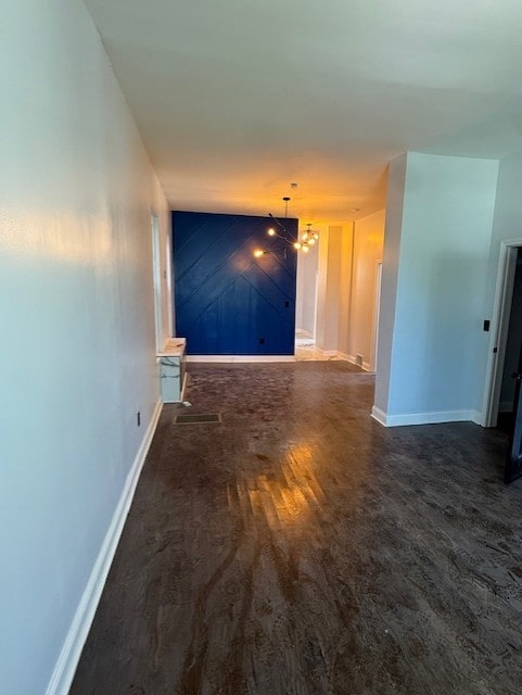 7 W 112th Pl, Chicago, IL 60628 - corridor with wood finished floors, a chandelier, and baseboards