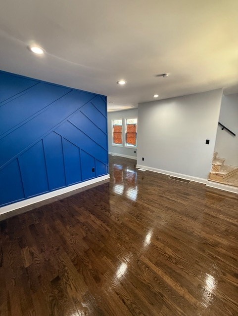 7 W 112th Pl, Chicago, IL 60628 - unfurnished living room featuring wood finished floors, baseboards, and recessed lighting
