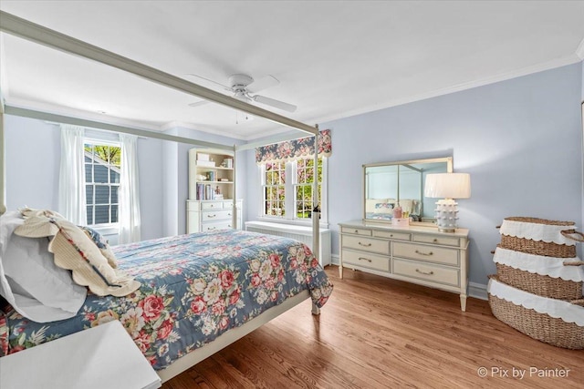 705 Hunter Rd, Glenview, IL 60025 - bedroom featuring wood finished floors, ornamental molding, baseboards, and a ceiling fan