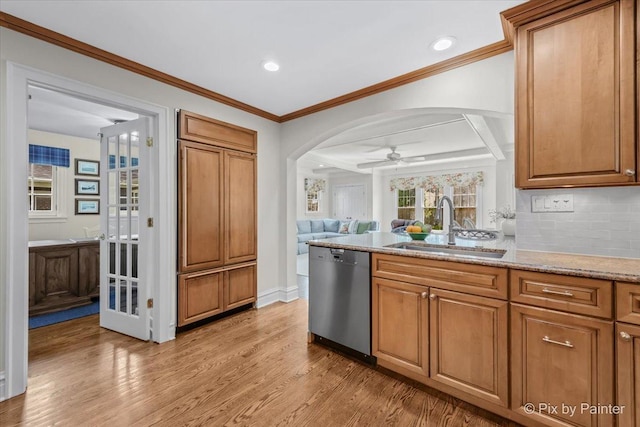 705 Hunter Rd, Glenview, IL 60025 - kitchen featuring dishwasher, a sink, arched walkways, light wood-style flooring, and a ceiling fan