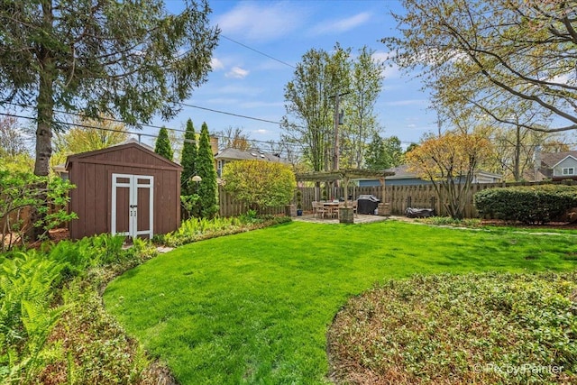 705 Hunter Rd, Glenview, IL 60025 - view of yard featuring a pergola, a storage unit, an outbuilding, and a patio area