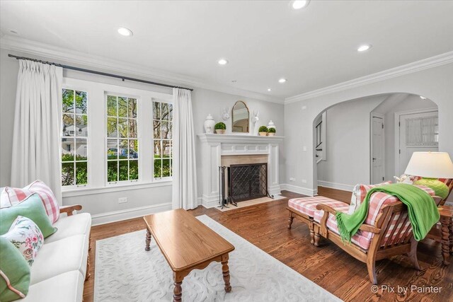 705 Hunter Rd, Glenview, IL 60025 - living area featuring baseboards, ornamental molding, arched walkways, recessed lighting, and wood finished floors