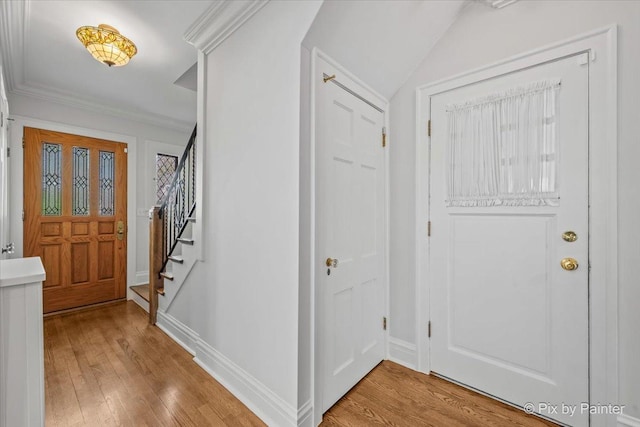 705 Hunter Rd, Glenview, IL 60025 - entryway featuring stairway, light wood-style floors, baseboards, and ornamental molding