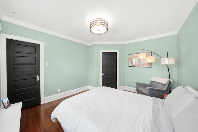 bedroom with dark wood-style flooring, baseboards, and crown molding