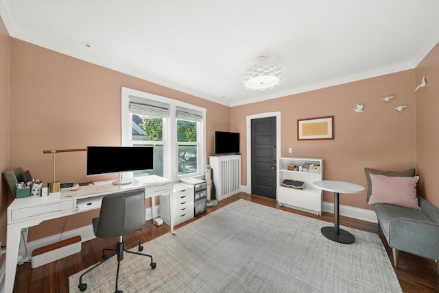 home office featuring radiator heating unit, crown molding, wood finished floors, and baseboards