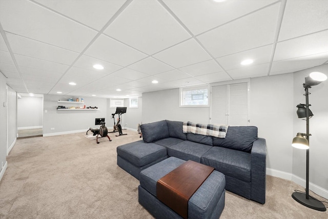 carpeted living area with baseboards and recessed lighting