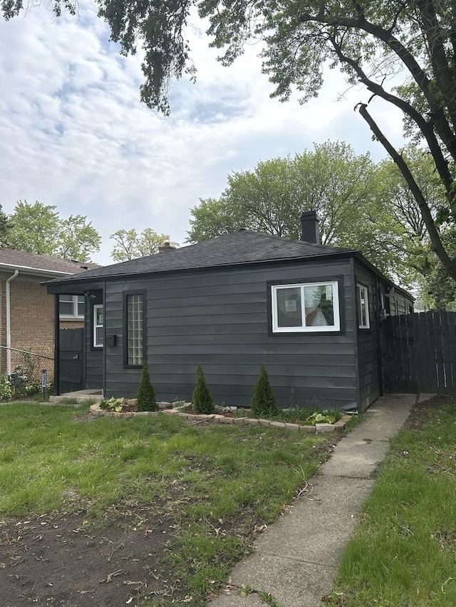 12509 S Bishop St, Calumet Park, IL 60827 - view of home's exterior featuring a chimney