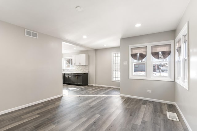 12509 S Bishop St, Calumet Park, IL 60827 - unfurnished living room with baseboards, dark wood-style floors, and recessed lighting