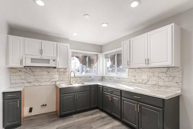12509 S Bishop St, Calumet Park, IL 60827 - kitchen with a sink, white microwave, white cabinetry, gray cabinets, and recessed lighting