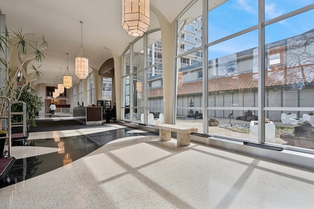 community lobby featuring a towering ceiling