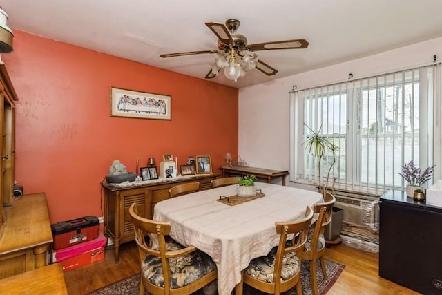 6555 W Addison St Unit A, Chicago, IL 60634 - dining room featuring a ceiling fan and light wood-style floors