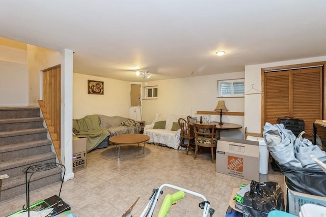 6555 W Addison St Unit A, Chicago, IL 60634 - living room featuring stairs and light tile patterned floors