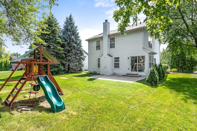 2248 Cheshire Dr, Aurora, IL 60502 - back of property with a playground, a chimney, and a lawn