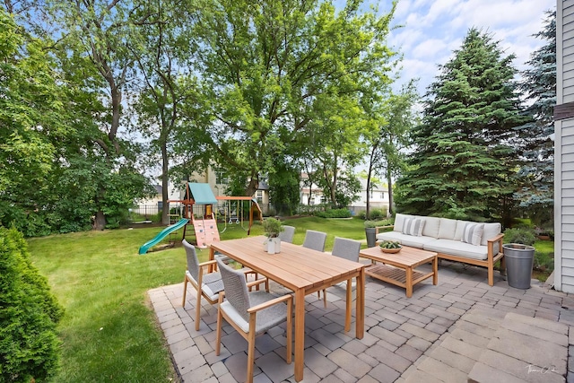 2248 Cheshire Dr, Aurora, IL 60502 - fenced backyard with a patio, a playground, an outdoor hangout area, and outdoor dining area