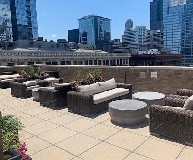 view of patio featuring an outdoor living space and a view of skyline