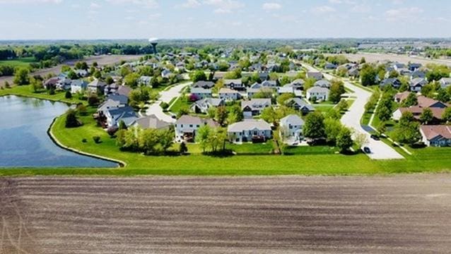 aerial perspective of suburban area featuring a large body of water
