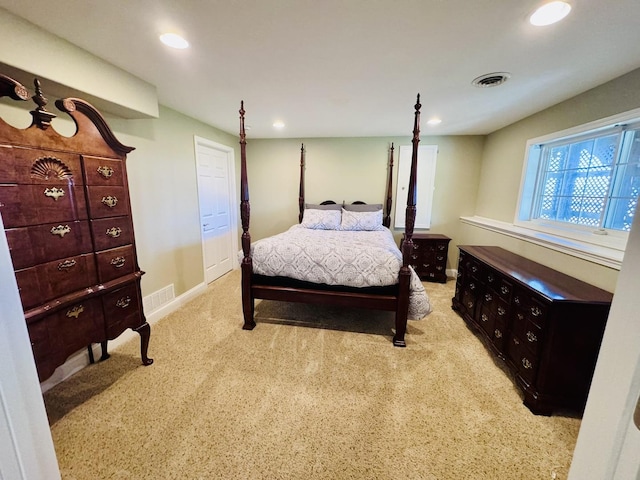 bedroom with recessed lighting, light carpet, and baseboards