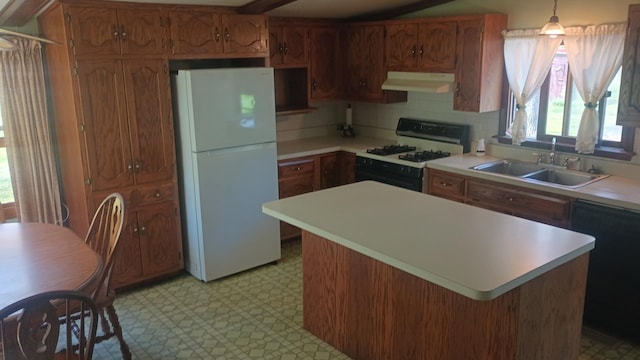 2119 E Exchange St, Crete, IL 60417 - kitchen featuring white appliances, under cabinet range hood, a sink, and light countertops