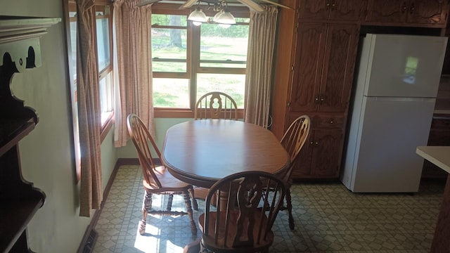 2119 E Exchange St, Crete, IL 60417 - dining area featuring light flooring, baseboards, and a chandelier