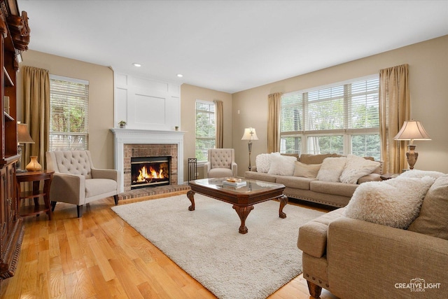 10650 Painted Desert Ct, Huntley, IL 60142 - living area with light wood-style floors, healthy amount of natural light, a brick fireplace, and recessed lighting