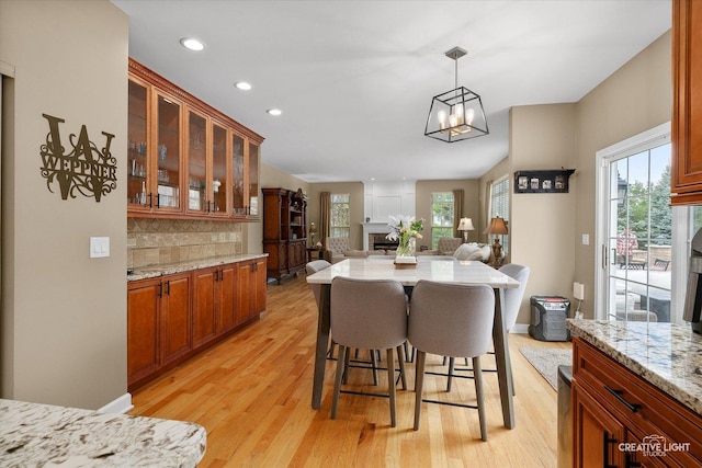 10650 Painted Desert Ct, Huntley, IL 60142 - dining area featuring light wood finished floors, healthy amount of natural light, recessed lighting, and a chandelier