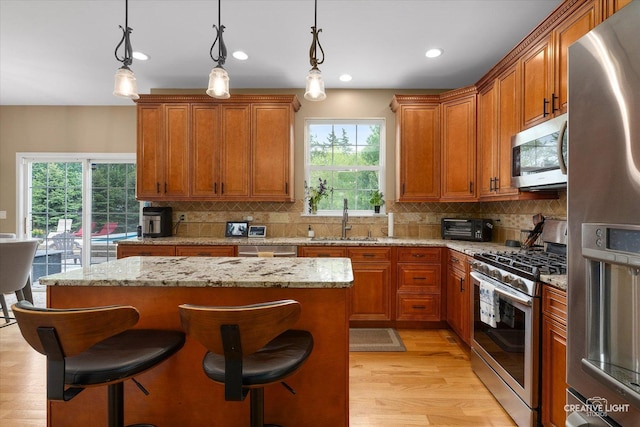 10650 Painted Desert Ct, Huntley, IL 60142 - kitchen with stainless steel appliances, a sink, healthy amount of natural light, backsplash, and recessed lighting