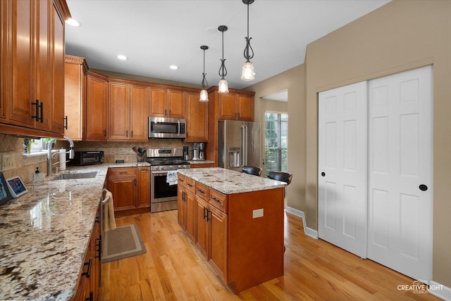 10650 Painted Desert Ct, Huntley, IL 60142 - kitchen with appliances with stainless steel finishes, brown cabinets, tasteful backsplash, and recessed lighting