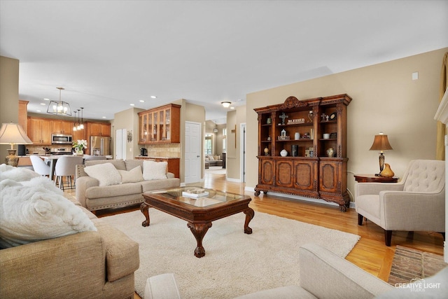 10650 Painted Desert Ct, Huntley, IL 60142 - living area featuring recessed lighting, light wood finished floors, a chandelier, and baseboards