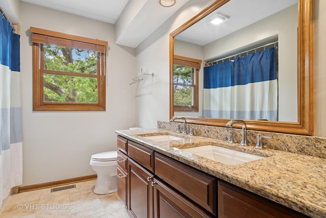 16 Rock River Ct, Naperville, IL 60565 - full bathroom featuring baseboards, double vanity, toilet, and tile patterned flooring