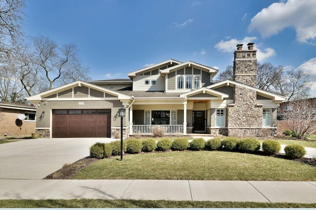 craftsman house with stone siding, covered porch, a chimney, and an attached garage