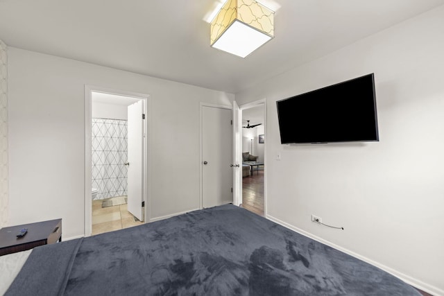 unfurnished bedroom featuring baseboards, ensuite bath, and carpet floors
