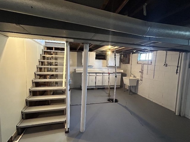 below grade area with a sink and stairs