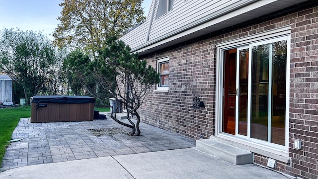 view of patio featuring a hot tub and entry steps