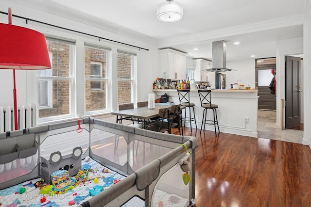 5814 N Campbell Ave, Chicago, IL 60659 - living area featuring ornamental molding, wood finished floors, and recessed lighting