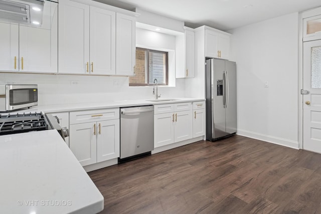 5814 N Campbell Ave, Chicago, IL 60659 - kitchen featuring stainless steel appliances, light countertops, white cabinets, and dark wood finished floors