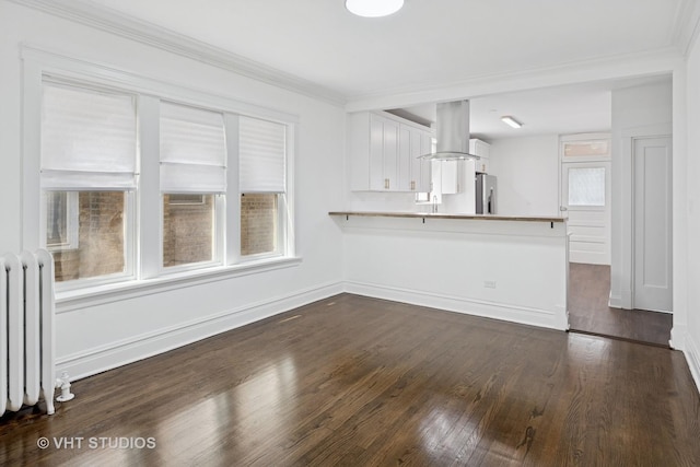 5814 N Campbell Ave, Chicago, IL 60659 - unfurnished living room featuring radiator heating unit, healthy amount of natural light, dark wood-style flooring, and ornamental molding