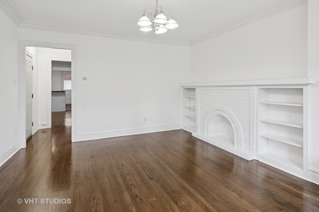 5814 N Campbell Ave, Chicago, IL 60659 - unfurnished living room featuring a chandelier, crown molding, wood finished floors, built in shelves, and a fireplace