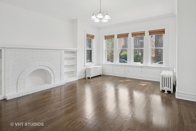 5814 N Campbell Ave, Chicago, IL 60659 - unfurnished living room with radiator, built in shelves, a chandelier, wood finished floors, and ornamental molding