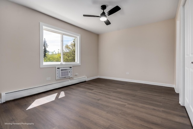 unfurnished bedroom with a baseboard radiator, a wall unit AC, dark wood finished floors, baseboards, and ceiling fan