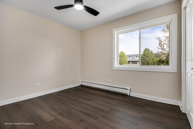 empty room with a baseboard radiator, dark wood-style flooring, baseboards, and a ceiling fan