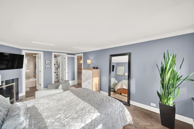 2626 N Lakeview Ave Unit 2703, Chicago, IL 60614 - bedroom with crown molding, baseboards, and ensuite bathroom