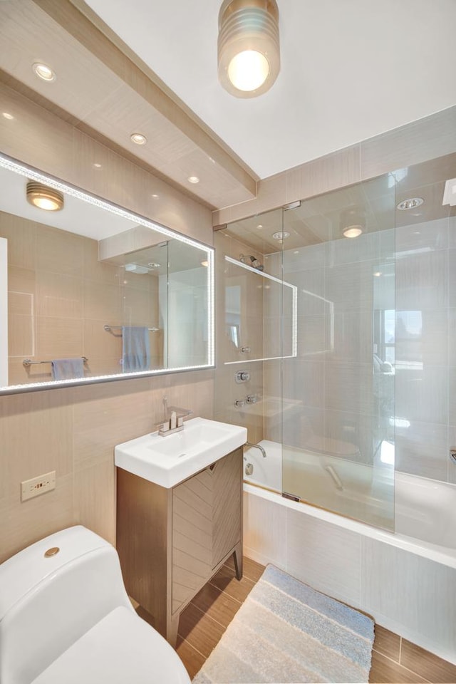 2626 N Lakeview Ave Unit 2703, Chicago, IL 60614 - full bathroom with tiled shower / bath combo, vanity, tile walls, and toilet