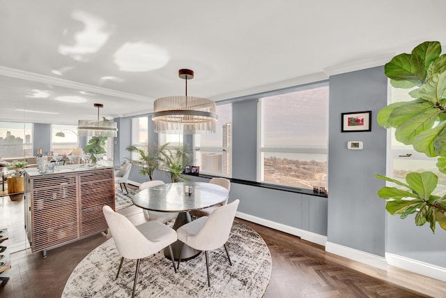 2626 N Lakeview Ave Unit 2703, Chicago, IL 60614 - dining space featuring baseboards, ornamental molding, and a chandelier