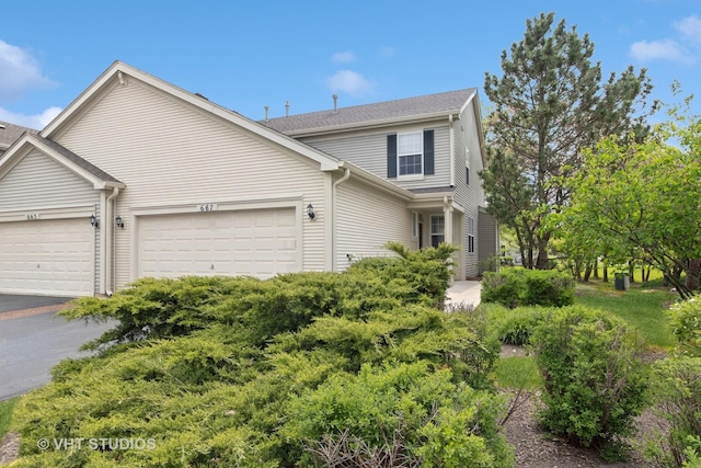 667 W Jonathan Dr, Round Lake, IL 60073 - view of front facade featuring a garage