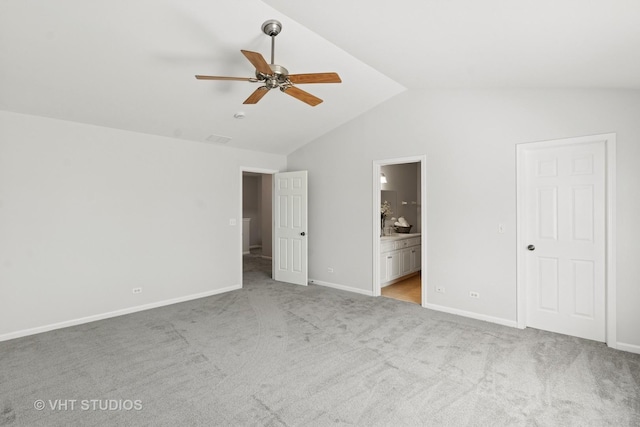 667 W Jonathan Dr, Round Lake, IL 60073 - unfurnished bedroom featuring vaulted ceiling, carpet flooring, baseboards, connected bathroom, and a ceiling fan