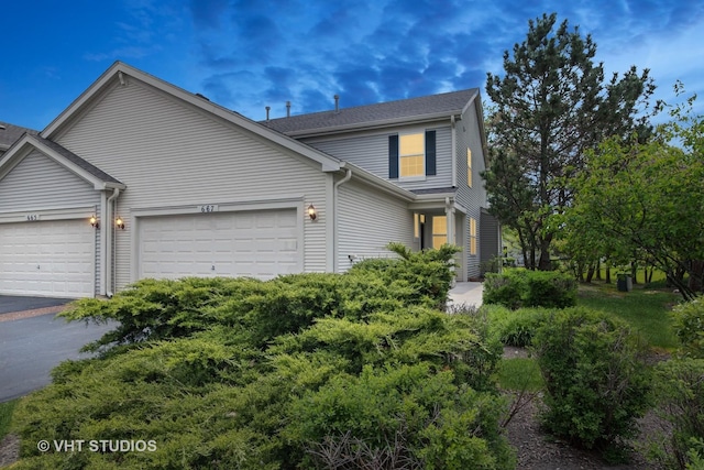 667 W Jonathan Dr, Round Lake, IL 60073 - view of front facade with a garage