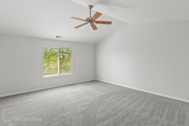 667 W Jonathan Dr, Round Lake, IL 60073 - empty room with a ceiling fan, lofted ceiling, carpet flooring, and baseboards